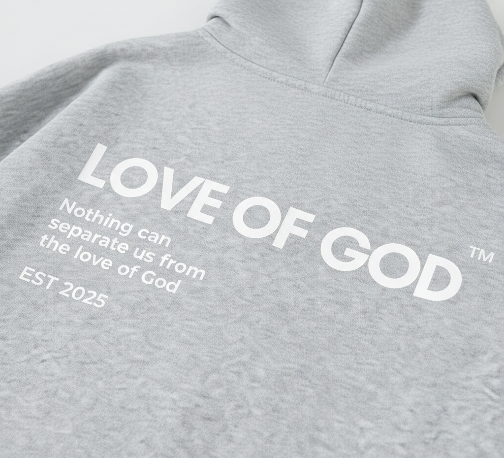 Gray hoodie with 'LOVE OF GOD' text on a light gray background