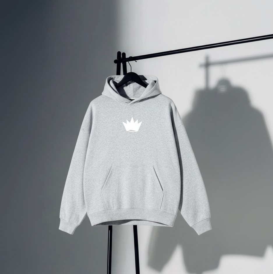 Gray hoodie with a white crown logo on a stand against a gray background