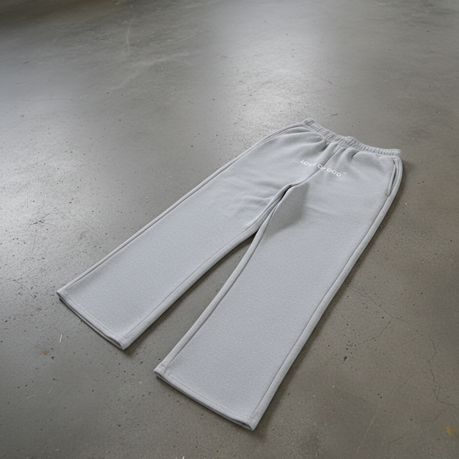 Gray sweatpants on a gray concrete floor